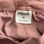 Gymshark mauve colored fitness shorts with drawstring waist & pockets. Size XS. Photo 3