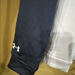 Under Armour California Golden Bears  Sweatshirt Women's Burgundy/Light Gray Terry Fleece Blocked Hoodie With Hat Sz M NWT  New with tag  Same day shipping  Smoke and pets free  This  hoodie is perfect for anyone looking for a comfortable and stylish addition to their wardrobe. With a burgundy, white, and gray color-blocked design and halo gray accents, this hoodie is sure to stand out. It features a hood and long sleeves, making it perfect for all seasons. The polyester material is breathable and durable, ensuring that it will last for years to come. The M size is perfect for both men and women, with a regular fit that is comfortable and flattering. This hoodie is great for casual wear or for working out, and the fleece fabric provides added warmth on cooler days. Get ready for game day with this California Golden Bears  sweatshirt! Made for women, this burgundy and light gray sweatshirt is perfect for football season. The athletic style is great for any sport. The sweatshirt is also an officially licensed NCAA product. Don't miss out on showing your team spirit with this new sweatshirt! Photo 7