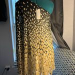 Julie Brown One-shoulder dress with a golden and black abstract print. Lightweight, flowy, Photo 3