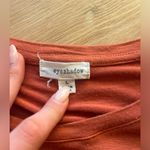 Eyeshadow  Burnt Orange knotted shirt. Size Large. Photo 1