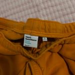Aritzia Orange TNA Cozy Fleece sweatpants Photo 2