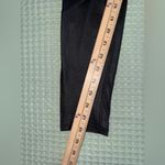 Alo Yoga Vitality Leggings in black with contoured performance lace panels Photo 1