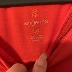 Tangerine  ladies athletic top.  Size: L.  Good condition! Photo 1