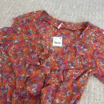 Free People NEW NWT  nina printed top in tulip ditsy orange floral bell sleeve Photo 5