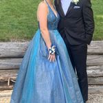 Rip In lace on the back, only worn once so I’m assuming it somehow happened when it was being stored in its dress bag. Dress from Glitterati Originally $550 Blue Size 6 Photo 3