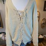 Umgee  cream colored v-neck lace up back long sleeve sweater. Photo 2