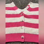 Jessica Simpson , pink and off-white striped cropped cardigan.￼ Photo 1