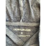 Calvin Klein Jeans Blue Hoodie T-Shirt Top size Medium Long Sleeve NWT Photo 1