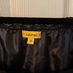 Lulumari  drawstring empire waist dress with embroidered floral appliqués. Photo 4