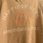 American Eagle  Funday Graphic Happiest Here Smiley Tan Sweatshirt - size XL Photo 1
