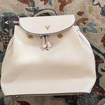 Stylish Cream Backpack with Gold Accents Photo 0