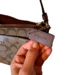 Coach Signature East/ West with Pop-up Cross Bag Photo 1