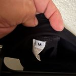 Sleek Black Capris with Form Photo 1