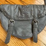 Gray studded faux leather cross body bag. Magnetic snaps on the front. Photo 1