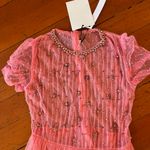 Elegant Pink Midi Dress with Star Accents Photo 9