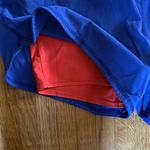 Nike  Dri-fit Blue and Neon Orange Shorts. Size medium Photo 1