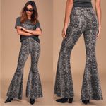 Free People • snakeprint flare jeans sz 26 Photo 1