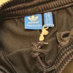 Adidas NEW women's small black/white tapered leg sweatpants Retails $75 Photo 1