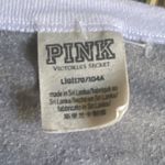 Victoria's Secret -PINK NATION-LONG SLEEVE GRAY TOP-SIZE LARGE Pink Nation logo on front and large Pink Nation on the back. Excellent condition Mead: Bust: armpit to armpit 22 inches Length: shoulder seam to bottom 25 1/2 inches Photo 4