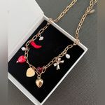 Free People  Gold Charm Necklace with Red and Silver Accents Photo 4