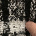 Me Too Black/White Ponco with fringe on edges and solid black cow neck. Photo 4