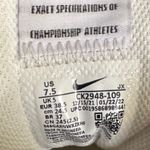 Nike Cream and Orange Sneakers Photo 2