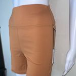 We Wore What ‎ Nylon Biker Short in Gold Photo 8