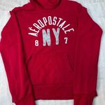 Aeropostale Womens Small Red Hoodie Pullover NY Glitter Logo Sweatshirt Photo 0