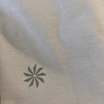 Athleta  Women’s Athletic Shirt size XL color white length 28” bust 40” Photo 4