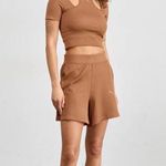 Puma ‘Dare To’ Cropped Tee with Cut Out Short Sleeves in Mushroom Brown Photo 0