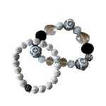 Pair of Black and White Stone and Glass Stretch Bracelets Photo 0