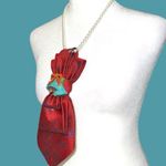 “Dainty Dapper” festive Red Patterned Tie necklace with Blue Accents and bells Photo 2