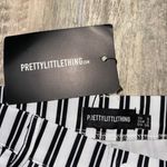 Pretty Little Thing NWT  Black/White Stripped Bell Bottom Flare Pants Women’s Sz 2 Photo 3