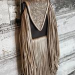 Deep brown and golden browns are stunning on this leather crossbody purse. Photo 1