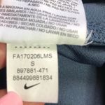 Nike  Women’s Athletic Mid-Rise Logo Front Capri Tights Photo 5