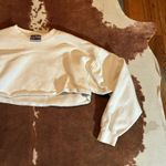 Hanes Cropped white  sweatshirt best fits a small  Was cropped by me so keep that in mind it has a raw hem! Photo 1