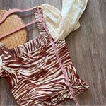 Anthropologie love the label zebra laser cut puff sleeve smocked blouse Photo 1