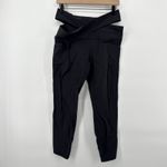 Athleta  Salutation Stash Wrap Tight Black High Rise Yoga Leggings Pockets‎ Large Photo 1