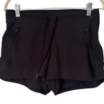 Athleta  Black Pull In Athletic Shorts Zipper Pockets Women’s Size 6 Photo 0