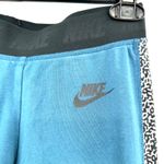 Nike size small full length blue athletic leggings stirrup detail black white Photo 2