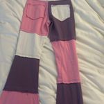 pink and purple bell bottom jeans Photo 1