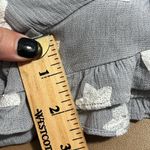 Storia  medium v-neck grey romper white embroidered starts ruffle batwing sleeves Photo 8