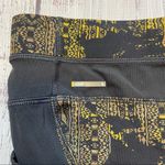 Lole  Burst Black and Gold Print Ankle Leggings. Size Small. EUC Photo 3