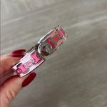 Halcyon Days Chain enamel hinged bangle in a pink and gold colorway. Silver Photo 4