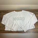 Lululemon  Muscle Love Long Sleeve Motif Logo White Oversized Crop Photo 4