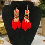 Red feather earrings with gold accents, featuring a mix of boho and western styles Photo 2