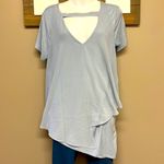 Lisa Rinna Asymmetrical Light Blue Shirt Horizontal and Lace Accents Photo 3
