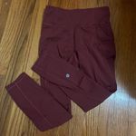 Lululemon 7/8 cropped leggings in a reddish color a bit warmer than maroon. Photo 1