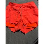 Athleta Trekkie Crest 2 in 1 shortie size 8 orange racing red Photo 2