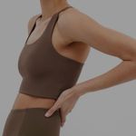 Girlfriend Collective • Designed for medium impact activities • Double lined, sweat-wicking material with four way stretch • Racerback • Scoop neck • Built-in support band • Form-hugging fit • Poly/spandex blend Photo 1